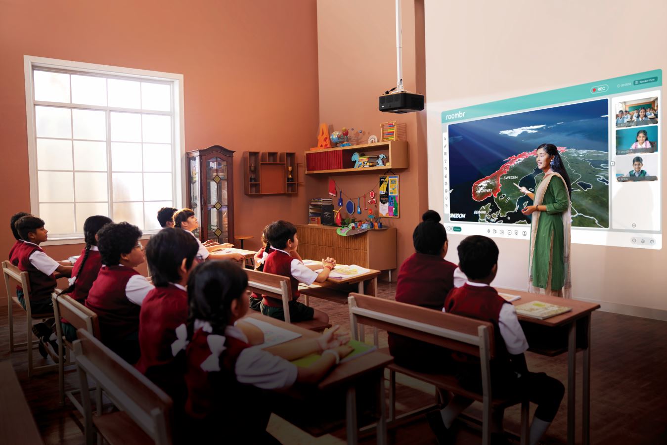 Teacher interacting with students in a modern classroom
